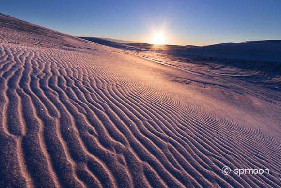 White sand dunes takes on pink color at sunrise, White Sands National Monument, New Mexico